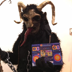 Krampus horn contest finalist with prize. Photo by Ed Marsziewski